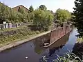 Bridge pier standing in the BCN Main Line canal. Harborne Junction was just to the right on the Stour Valley Line, which runs parallel to the canal.