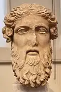 Marble head of Dionysus. Found in the theatre near the Zea harbor, Piraeus. It belongs to the Athens / Kos type, which is related to the Dionysus-Sardanapalus type. Classicising work of the 1st century A.D., inspired by 4th century B.C. original