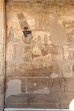 Relief showing Darius I offering lettuces to the Egyptian deity Amun-Ra Kamutef, Temple of Hibis