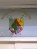 The Coat of arms of Cameroon above the entrance