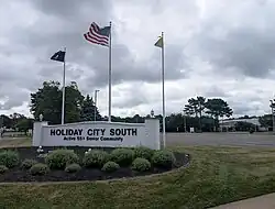 Welcome sign and clubhouse