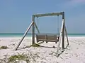 The swing says, "In loving memory of our dearest Erik"