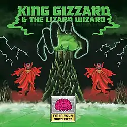 A mountain with a castle at the top of it. A large human hand hovers above it while two beings wearing cloaks float on both sides of the mountain.