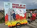 BUND at a rally for the mobility transition in Munich during the IAA 2021: poster of Markus Söder and the car lobby
