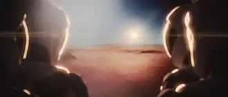 Four astronauts looking at Mars