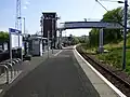 View past the footbridge towards the former IBM Halt.