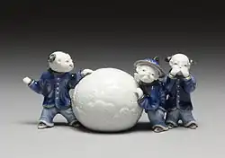 Mikawachi ware brush rest in the form of boys with a snowball, porcelain with underglaze blue, Edo period, 1800–1830