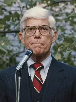 Anderson speaking into a microphone