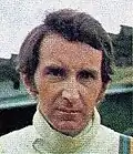 John Watson looking at the camera