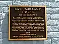 Informational commemorative plaque located on the brick façade between addresses 350 and 352 on Eighth Street in downtown Troy, NY