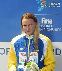 Sarah Sjöström holding the World Record Award at the 2015 World Championships in Kazan