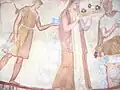 Mural of attendees bearing artifacts
