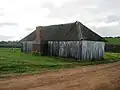 Timber slab and shingle farmhouse built by John Hassell