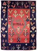 Late 18th century wedding ryijy made of plant-dyed yarn, featuring traditional motifs of husband and wife, plants, and birds.