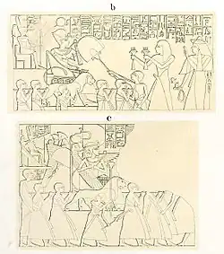 Man offering to statues carried by priests