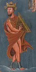 Detail visible through the harp stings. First Bible of Charles the Bald, 9th century A.D. The harp in this picture has been called "an unreal psaltery in the form of an almost equilateral triangle," an attempt to illustrate ancient instruments from the Bible, by 9th-10th century Europeans.[1]