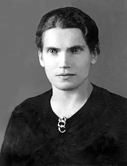 Black and white portrait of a young woman with a serious expression.