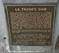 Plaque detailing history of Johnstone Park and LaTrobe Dam.