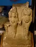 Limestone statuette of Akhenaten and Nefertiti, or Amenhotep III and Tiye,[60] and a princess. Reign of Akhenaten. From Amarna, Egypt. The Petrie Museum of Egyptian Archaeology, London