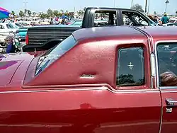 1970s opera window and vinyl landau roof imitating horse and buggy design, in particular the landaulet