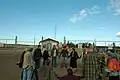 Lois Gibbs joins a circle of mine opponents to sing, pray and strategize at the entrance to the Kennecott Minerals sulfide mine that is being built near Lake Superior close to Big Bay, MI