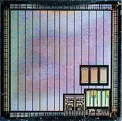 Die shot of a Matrox Mystique IS-MGA-1064SG graphics chips; most of the processor is covered by a power distribution network.