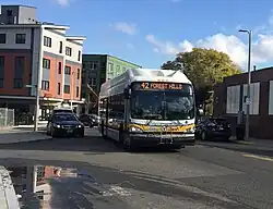 An MBTA bus in the area of Nubian Square in 2019