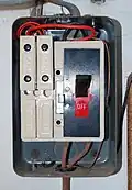 MEM rewirable fuse box with four rewirable fuse holders (two 30&nbsp;A and two 15&nbsp;A) installed c. 1957 (cover removed)