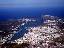 Mahon from the air with the Illa del Rei in the middle, above the city center.