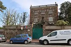 Color photograph of a house.