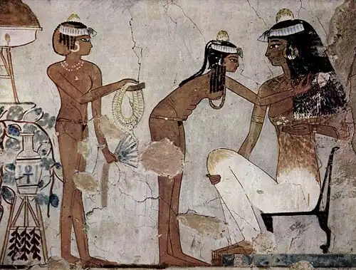Slave girls getting a woman dressed for the banquet