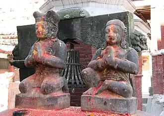 Malla king and queen doing Namaste (the ritual greeting) in front of the Chandeshwari Temple