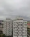 Renovated high-rises of the complex in 2020, without brick, with the concrete painted white
