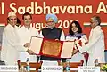Karan Singh, along with Prime Minister Manmohan Singh and Rahul Gandhi present the Rajiv Gandhi National Sadbhavana Award to Kiran Seth in 2011.