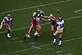 Rams QB Marc Bulger attempts a pass behind Brandon Moore (linebacker)