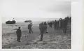 Marines of the 26th Marines wait for the word to deploy after coming ashore