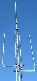 3 fiberglass half-wave whip antennas