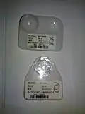 Intraoccular lenses in their cases