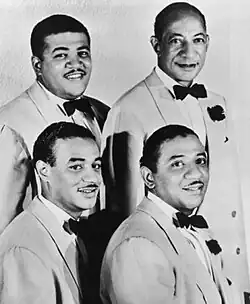The Mills Brothers in 1944. Clockwise from the top-left: Harry Mills, John Mills, Herbert Mills, Donald Mills