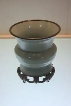 Photograph of a gray-blue porcelain vase.