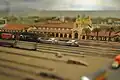 A model of the San Diego Union Station at the San Diego Model Railroad Museum along with a number of model trains.