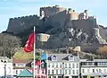 The pier below the castle contains restaurants, cafés and shops