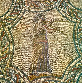 Mosaic depicting female Tibi'cina (tibia player) from House of Dionysus in Volubilis Morocco, part of the Roman Empire.