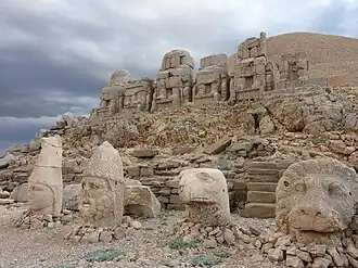 East terrace: Apollo-Mithra-Helios-Hermes, Heracles-Artagnes-Ares, Persian eagle, and lion