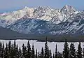 Winter scene of Mount Packenham centered between Evan-Thomas and Brock