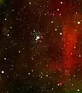The stars of NGC 2362 surrounding τ CMa (Infrared image taken by the Spitzer Space Telescope)