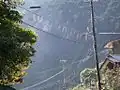 Web on electric power cable in Tanabe, Wakayama, Japan