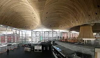 Reception area to the left with an upper floor to the right