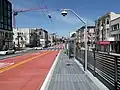 A bus stop in the median of an urban arterial