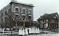 Nurses standing in from of Burge Hospital, Springfield, MO.